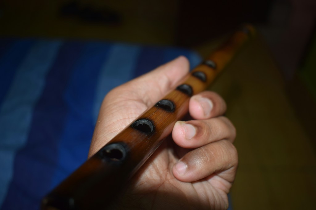Musician holding a flute during practice